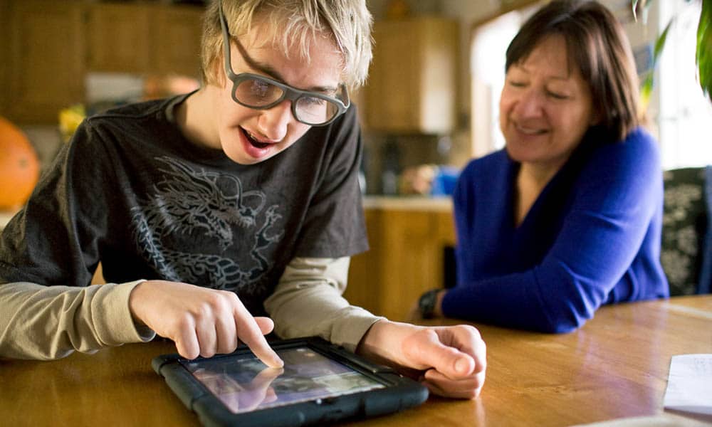 NICK WOLCOTT/CHRONICLE
Robert Bruckner, 13, a special education student at Bozeman's Chief Joseph Middle School, uses an iPad given to his mother by a Connecticut charity to help children with autism and special needs.
